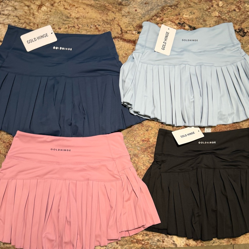 Goldhinge athletic shirts. Navy, light baby blue, black and medium pink